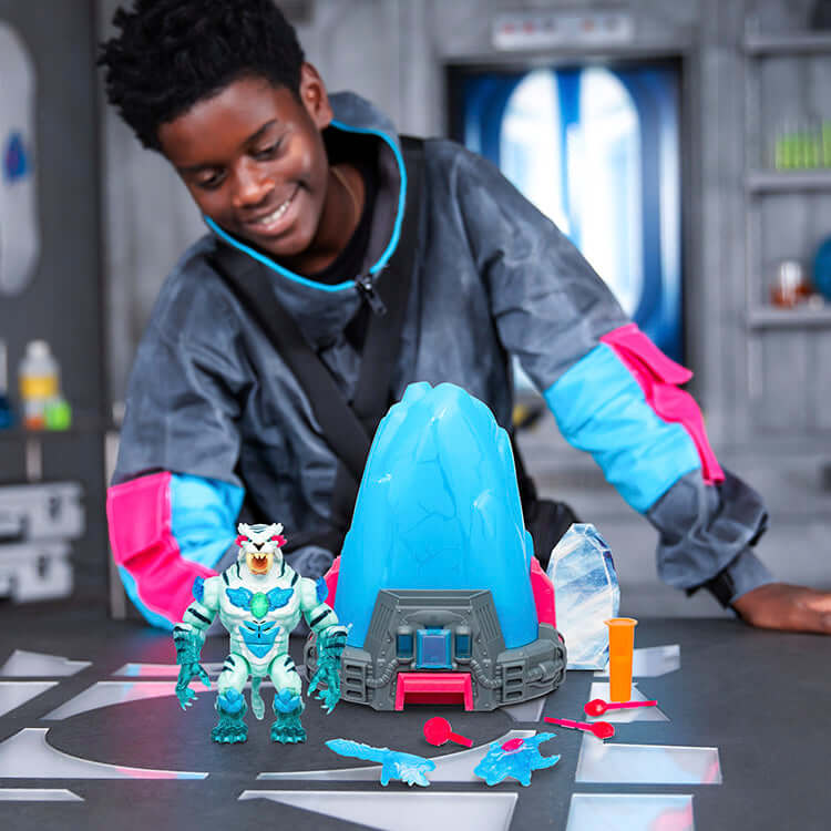 Child playing with MrBeast Lab Cryo Lab toy featuring a panther figure and interactive cryochamber in a futuristic setting.