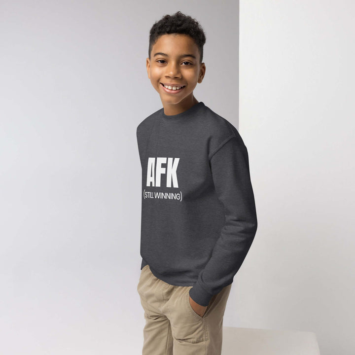 AFK youth crewneck sweatshirt on a smiling boy, showcasing comfort and style for active kids.
