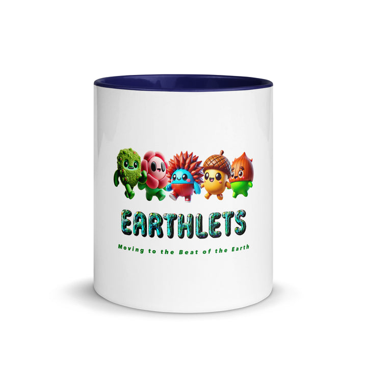 White ceramic mug with colorful inside featuring Earthlets characters and text design.
