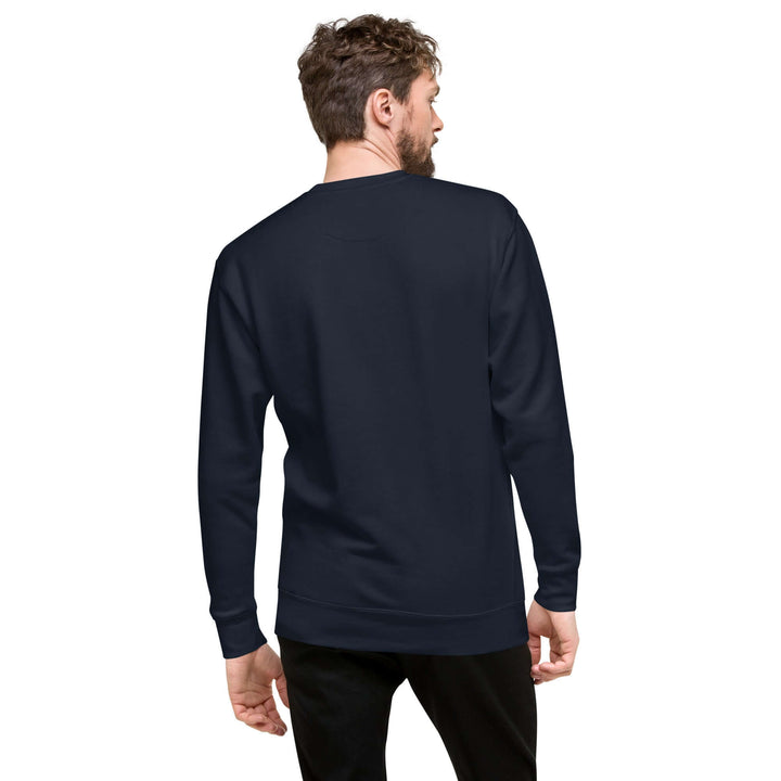 Model wearing a navy Earthlets unisex premium sweatshirt from the back, showcasing its classic silhouette.