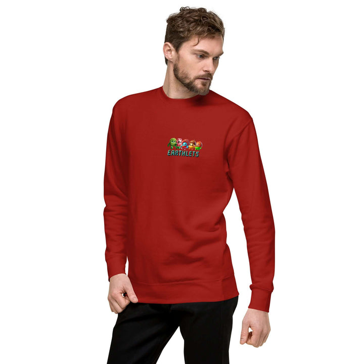 Earthlets Unisex Premium Sweatshirt in red worn by a model, featuring colorful graphic print.
