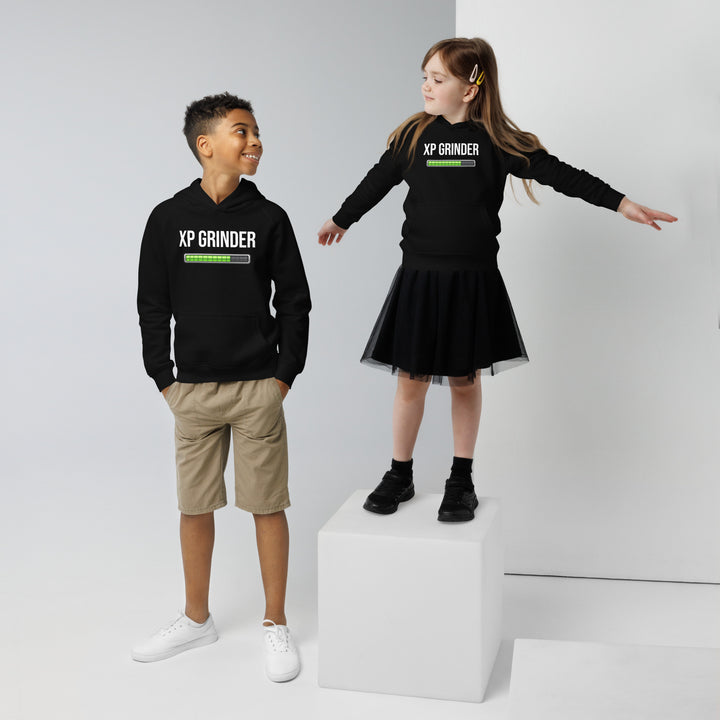 Two kids wearing XP Grinder Kids eco hoodie, one standing on a pedestal, showcasing a stylish and comfy eco-friendly design.
