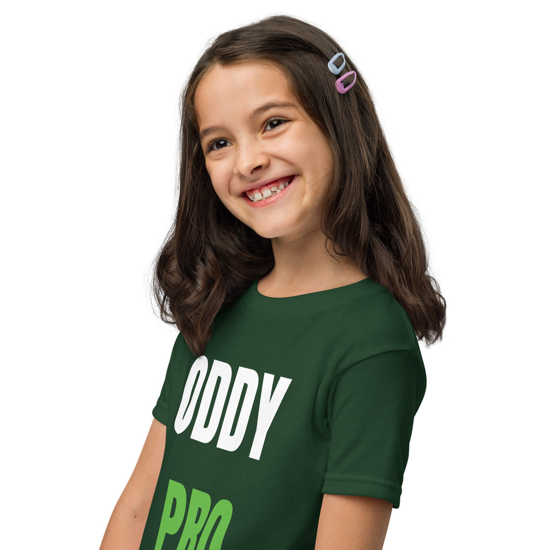Happy girl wearing an Oddy Pro Youth t-shirt in green, showcasing its modern fit and style.