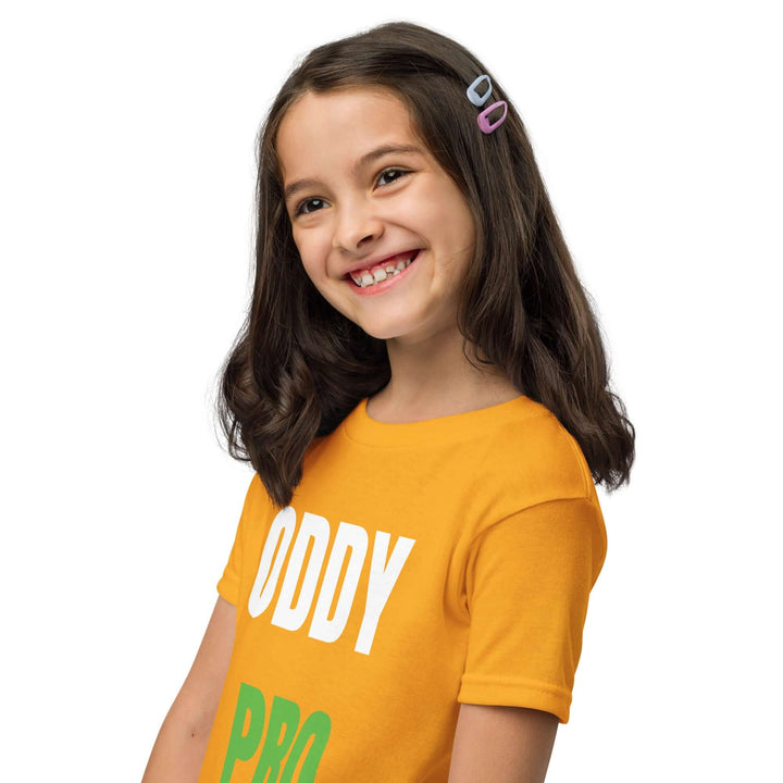 Smiling girl wearing an Oddy Pro Youth t-shirt in yellow, showcasing its modern fit and comfort.