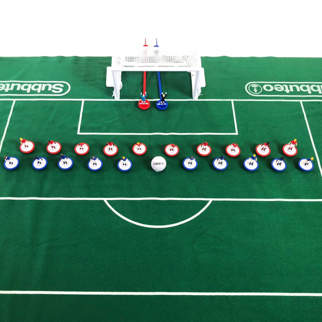 Subbuteo Main Game setup with players and goals on a green pitch, perfect for family fun and football competition.