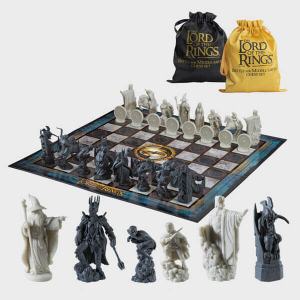 The Lord of the Rings - Battle For Middle Earth Chess Set displayed with iconic character pieces and a playing board.