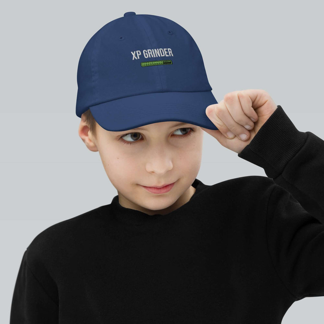 Child wearing an XP Grinder Youth baseball cap, showcasing comfort and style for baseball training.