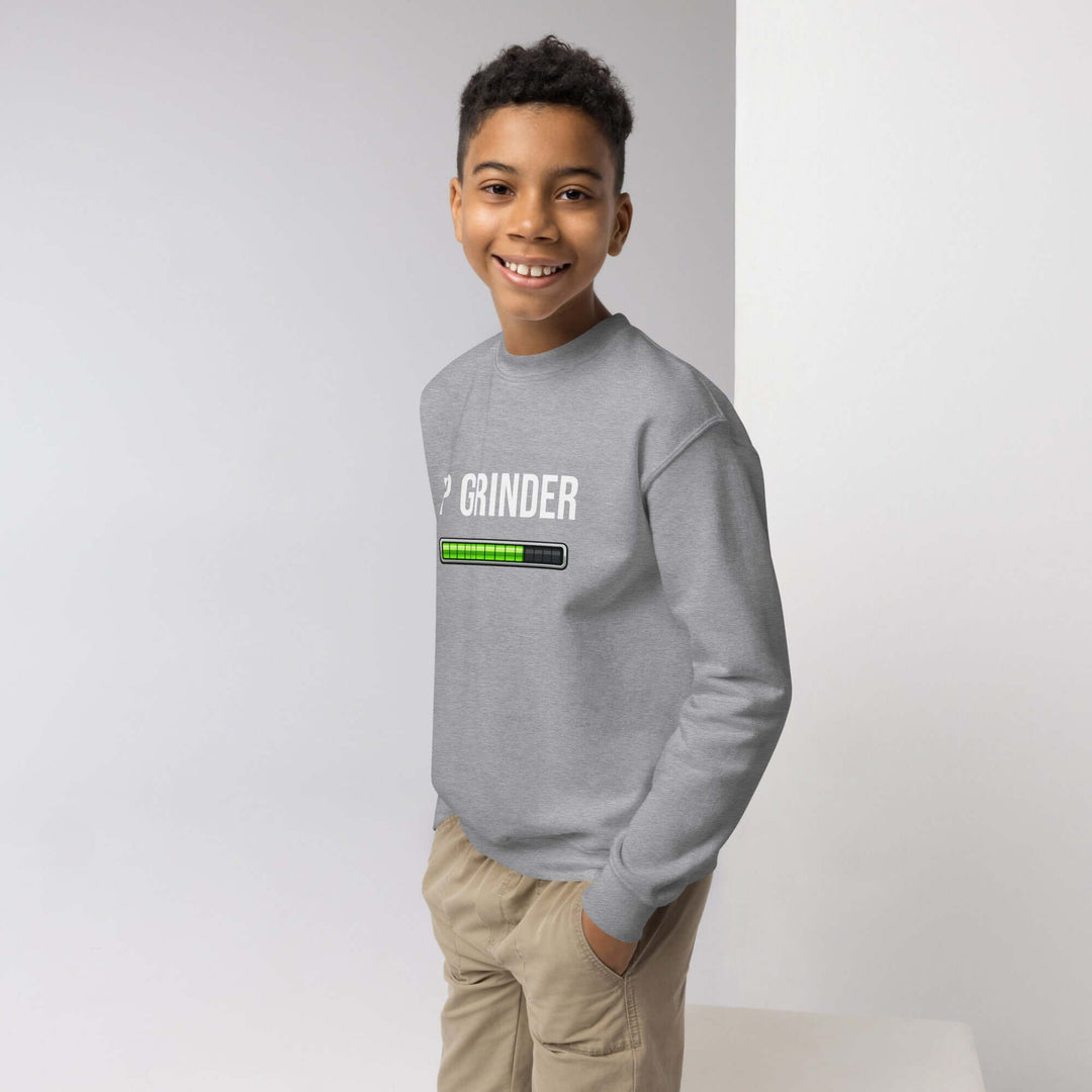 XP Grinder Youth crewneck sweatshirt in gray, styled on a young boy smiling.